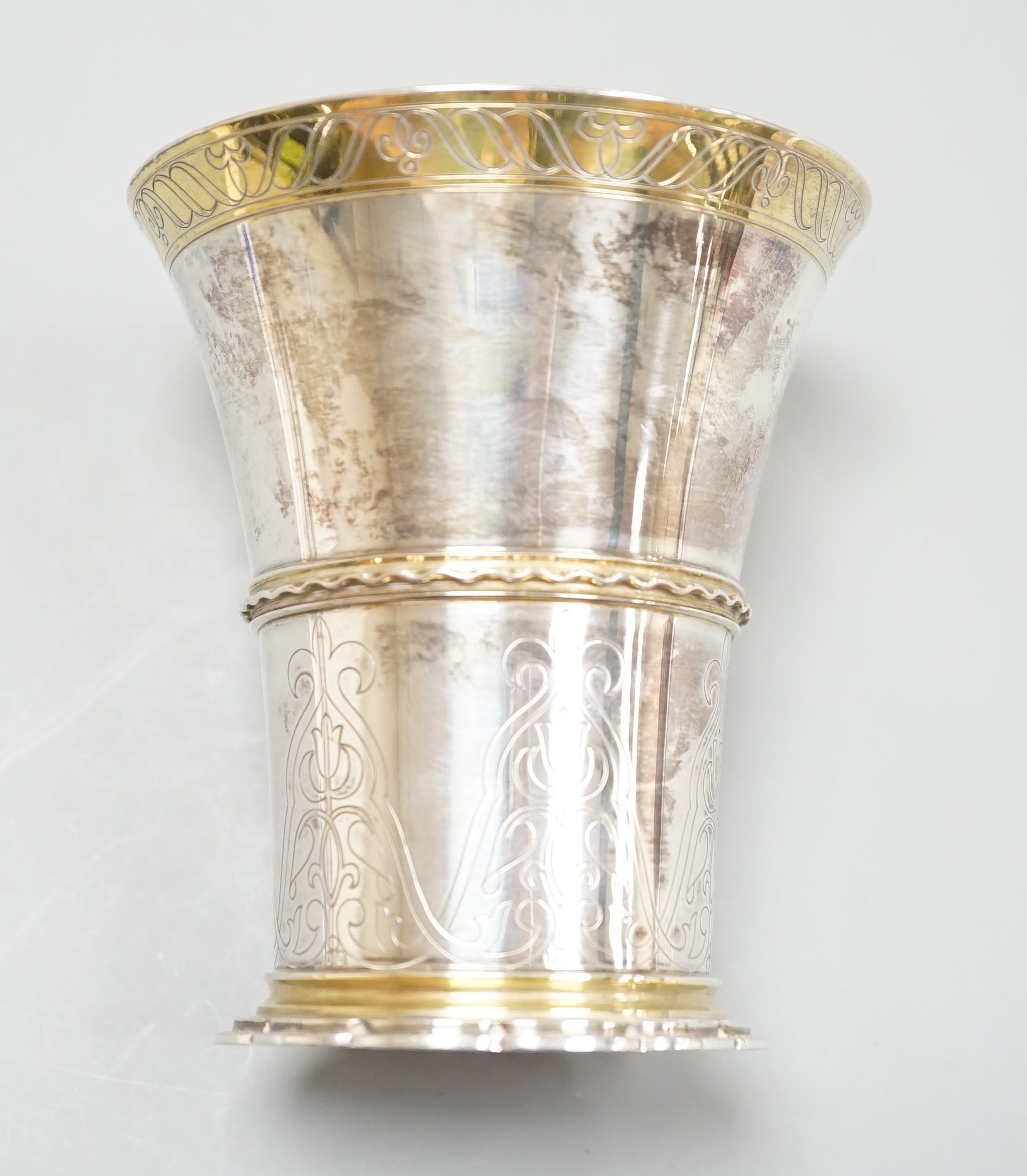 A German 800 standard parcel gilt white metal beaker, by Tezler, 10cm, 207 grams.